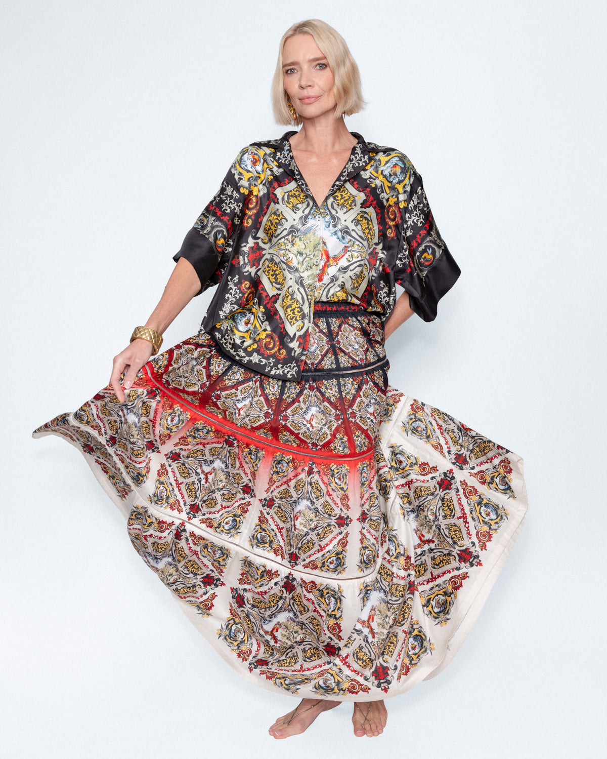 The Renaissance Maxi Skirt worn with a printed silk shirt, full length