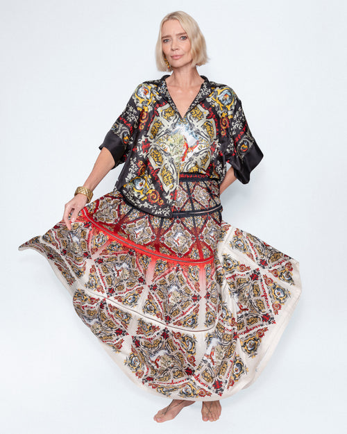 The Renaissance Maxi Skirt worn with a printed silk shirt, full length
