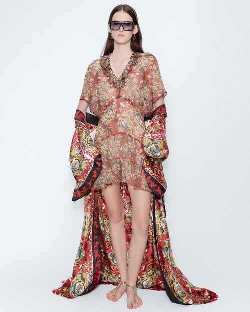 The Rococo Ruffle Mini Chiffon Dress worn with a long printed robe, full length