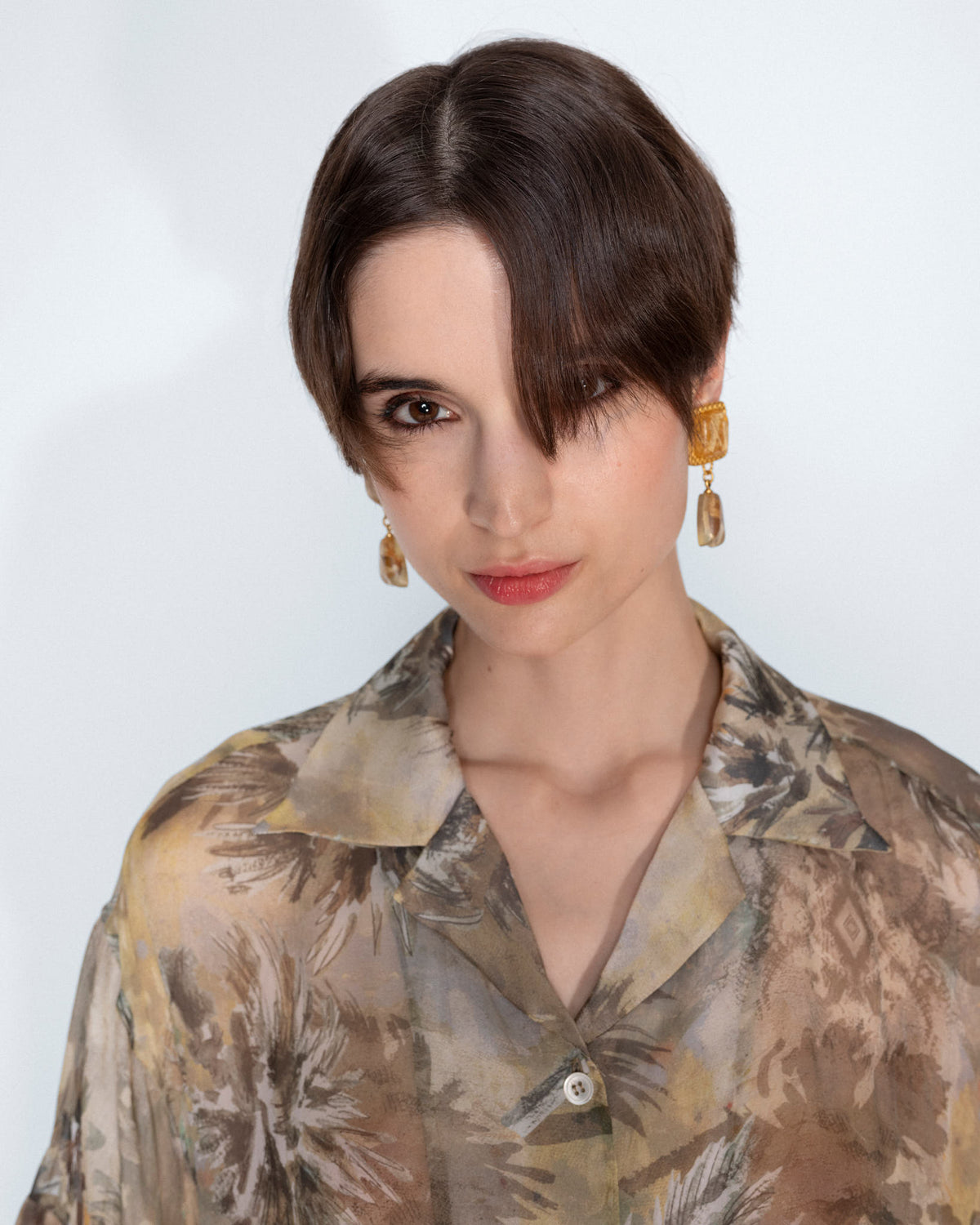 The Botanical Chiffon Blouse worn by a model, close up