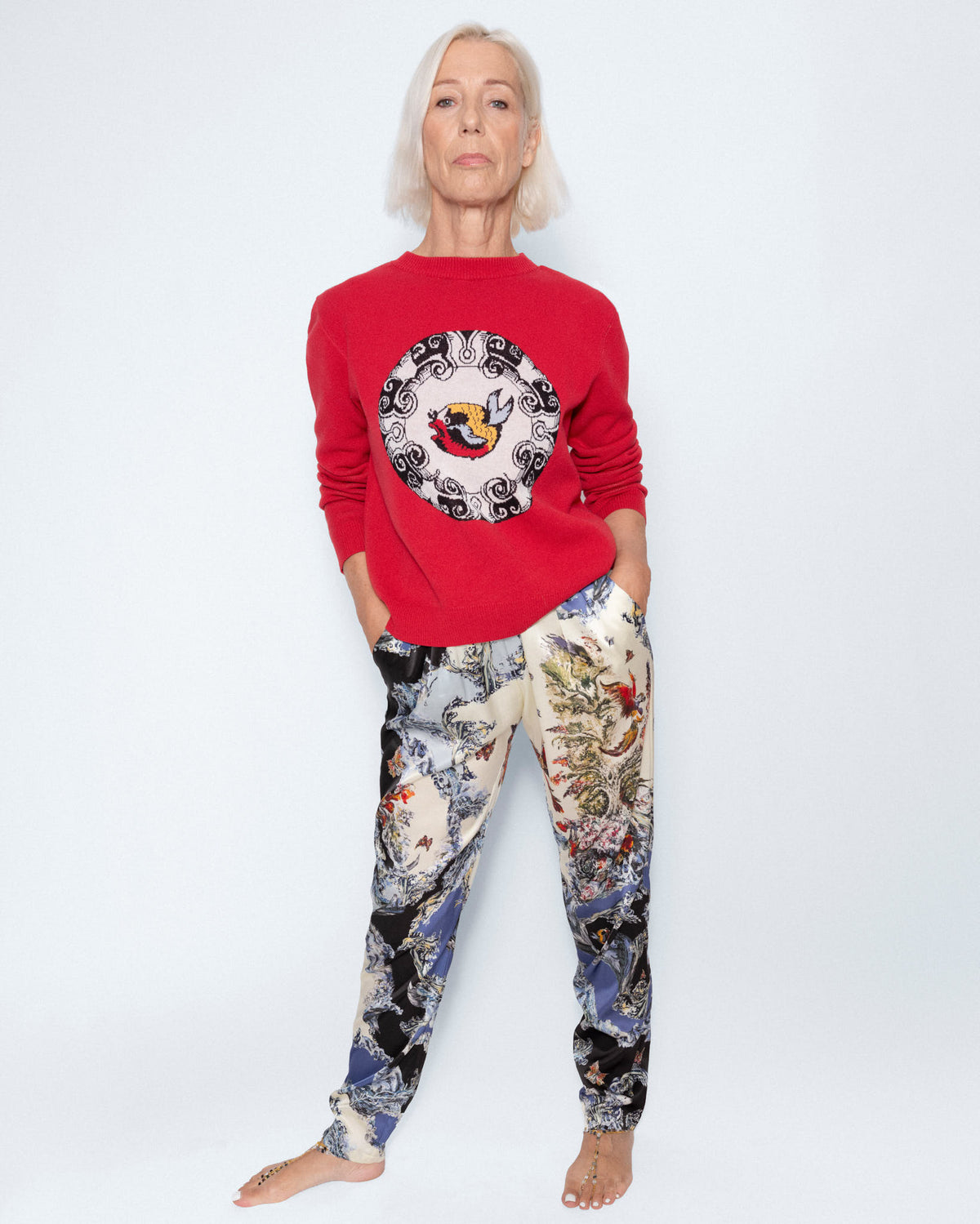 World On Fire Medallion Red Knit worn with The Silk Wave Lounge Trousers, full length