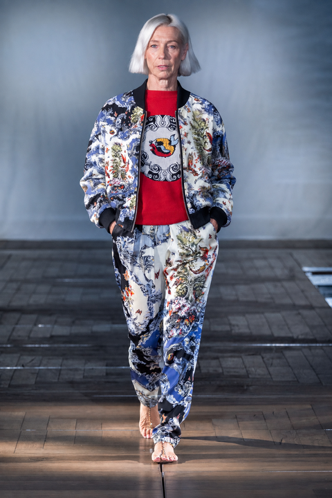 Celestial Garden Bomber Jacket worn on the runway with matching printed trousers