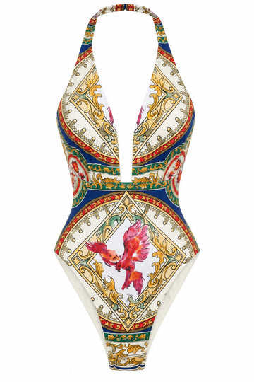 The Phoenix Bathingsuit, front: plunging halter swimsuit in a gold, blue and red baroque print with a phoenix