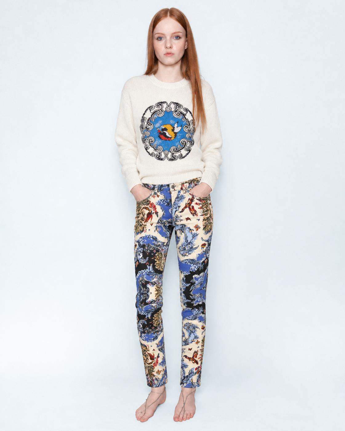 The Silk Wave Stretch Jeans worn with a cream knit jumper, full length