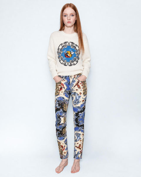 The Silk Wave Stretch Jeans worn with a cream knit jumper, full length