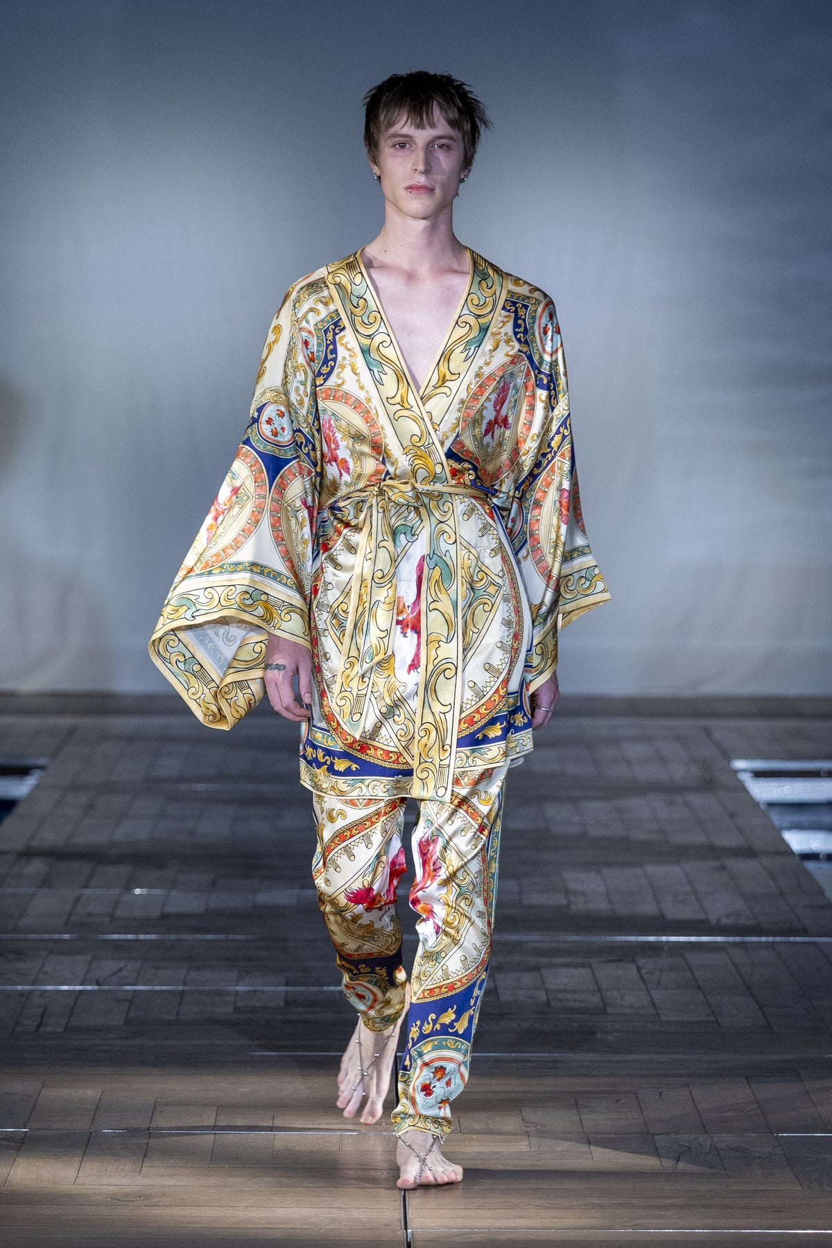 The Riviera Baroque Silk Trousers worn on the runway