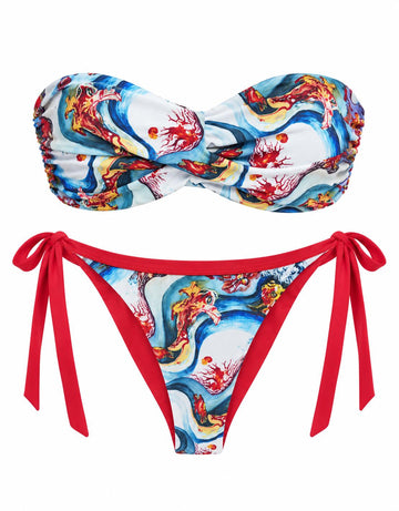 The Wave Fish Strapless Bikini, front: twisted bandeau top and tie-side bottoms in a blue, white and red wave and fish print
